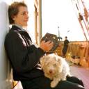 Relaxation: Rusty, the ships dog, being played a seranade by the Bosuns Mate. Photo by John Spiers