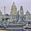 Durban Town Hall 1961: Here is a picture that I took on a rainy day while a Cadet on the S. S. Robin Hood. Missing from the photo are a couple of Zulu Warriors in full regalia with rickshaws. They had a regular business of giving rides to tourists for a moderate fee. It was actually a pretty exciting ride because they get up to a good run and slide back on the shafts. The cart would tip back and they would come off the ground giving the rider quite an unexpected experience. 
See the next photo for more details.