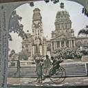 Durban Town Hall 1911?: As you can see, this is one half of a slide from a Victorian 3-D viewer. The angle is a bit different, but you can see that the building and monument had not changed much in half a century. This one also shows a warrior with a rickshaw like the one described in the previous photo. I would imagine, unless some ordinance now prevents it, that you could still get a rickshaw ride in front of the Town Hall. The power lines seem to be missing in this photo, but it may be because the angle was chosen to omit them.
